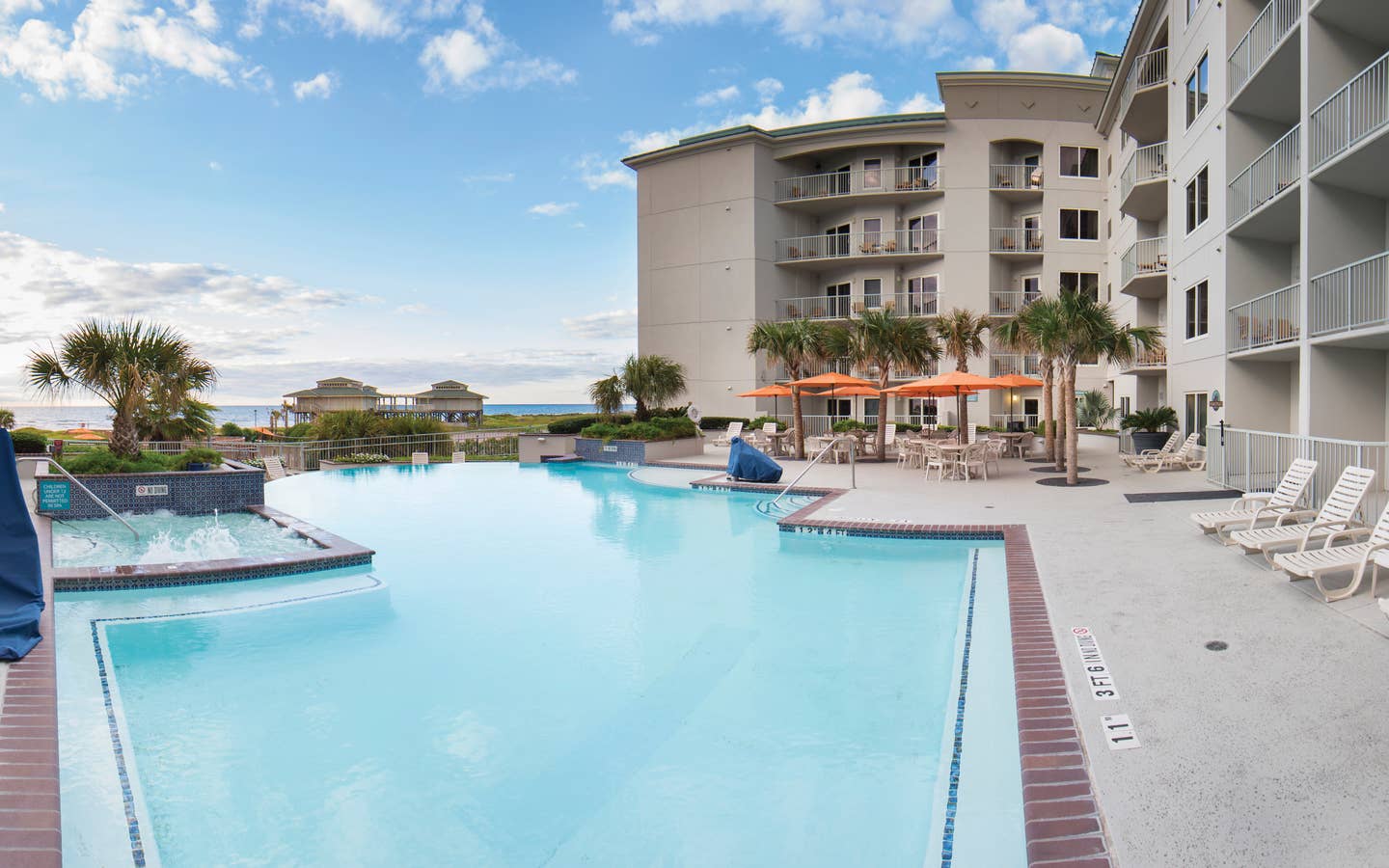 Outdoor infinity pool overlooking the beach at Galveston Beach Resort in Texas.