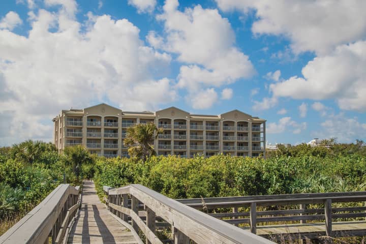 View of property buildings from beach at Cape Canaveral Beach Resort.