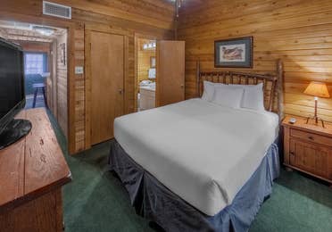 Bedroom in a cabin at Holly Lake Resort in Holly Lake Ranch, Texas.