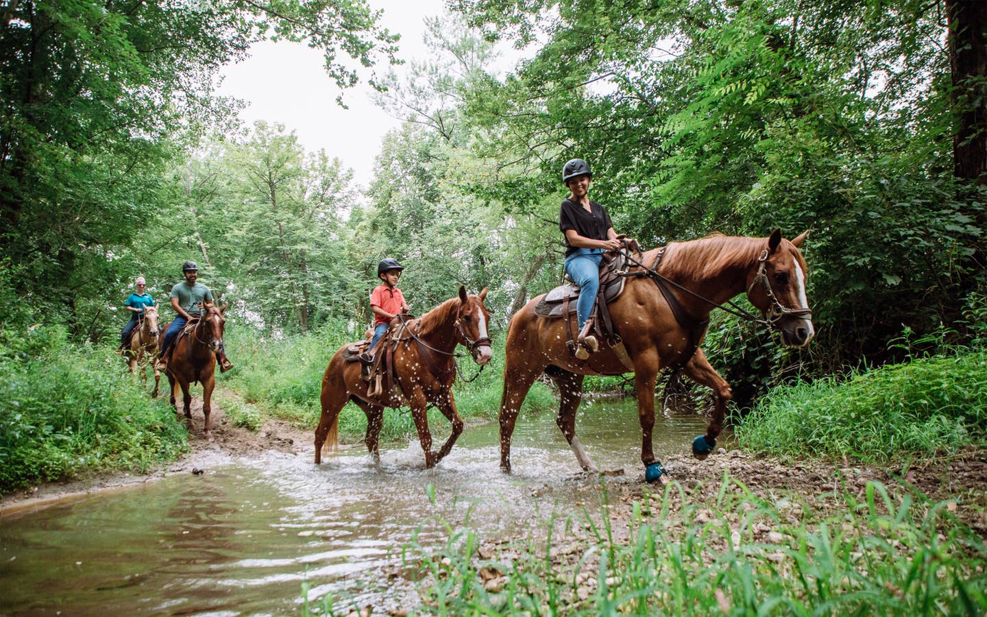 Guests riding horses at. Fox River Resort in Sheridan, Illinois.