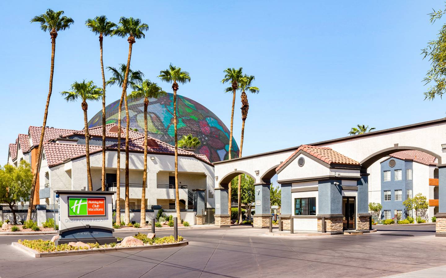 Entrance of Desert Club Resort in Las Vegas, Nevada with the Sphere behind.