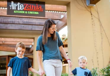 Adult and two young children by ArteZania Kitchen & Cantina at Scottsdale Resort in Scottsdale, Arizona