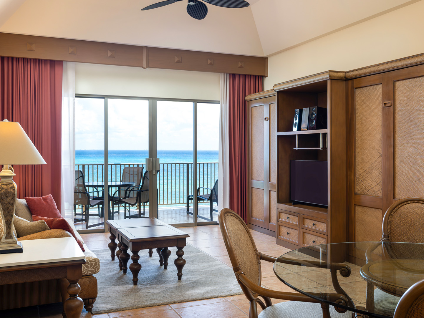 Spacious living room with Murphy bed and balcony access.