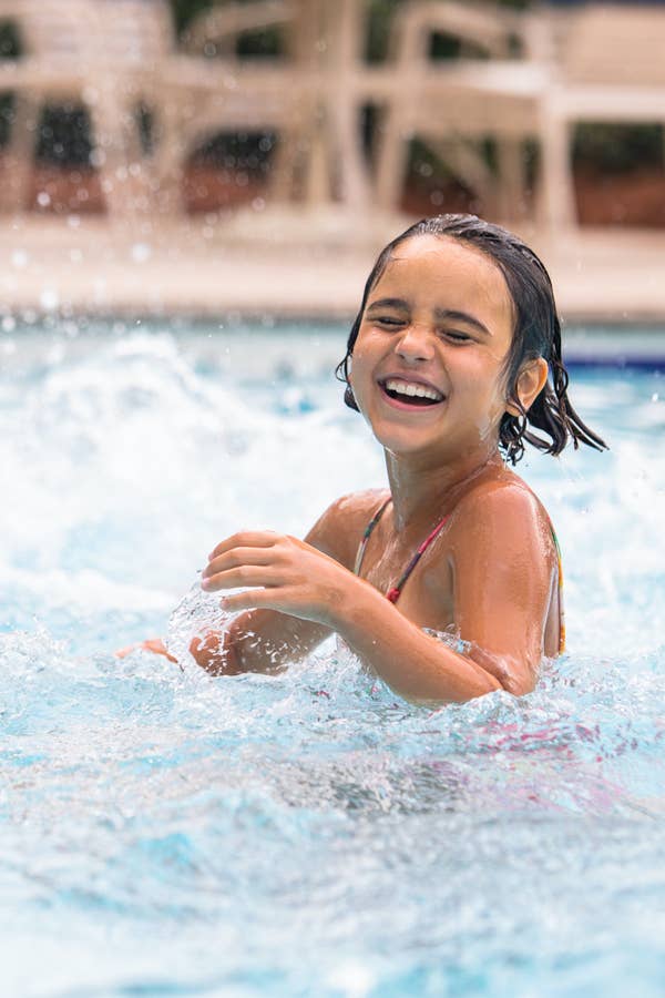 Young child splashing in swimming pool at South Beach Resort in Myrtle Beach, South Carolina.