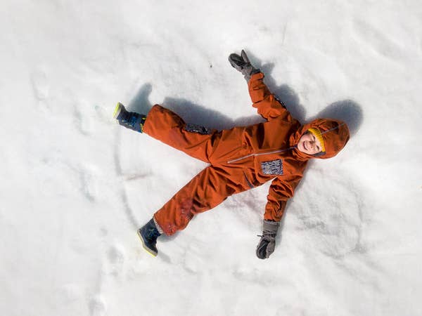 Child making snow angel near Tahoe Ridge Resort in Stateline, Nevada.