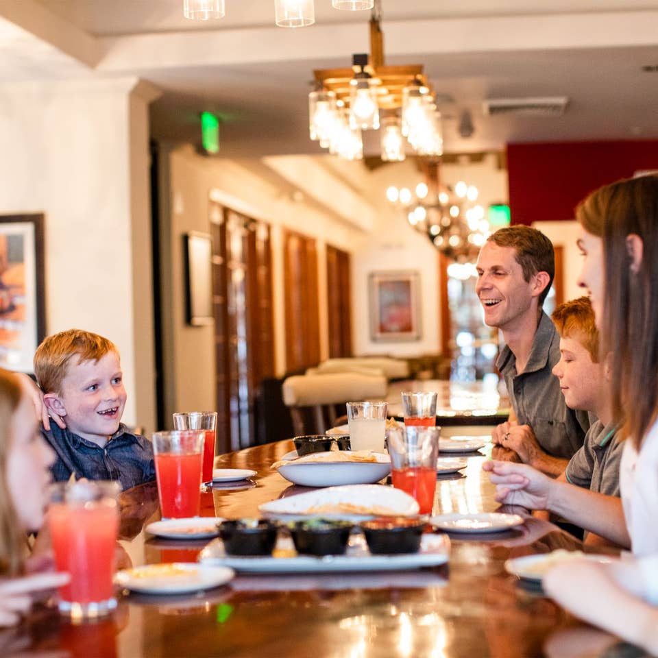 Family eating at ArteZania Kitchen & Cantina at Scottsdale Resort.