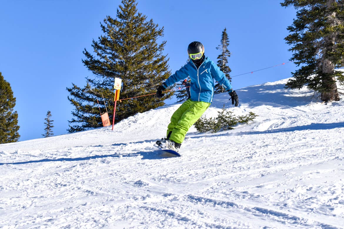 Contributor, Jessica Averett's daughter clad in winter and skiing gear ascends down the slopes.