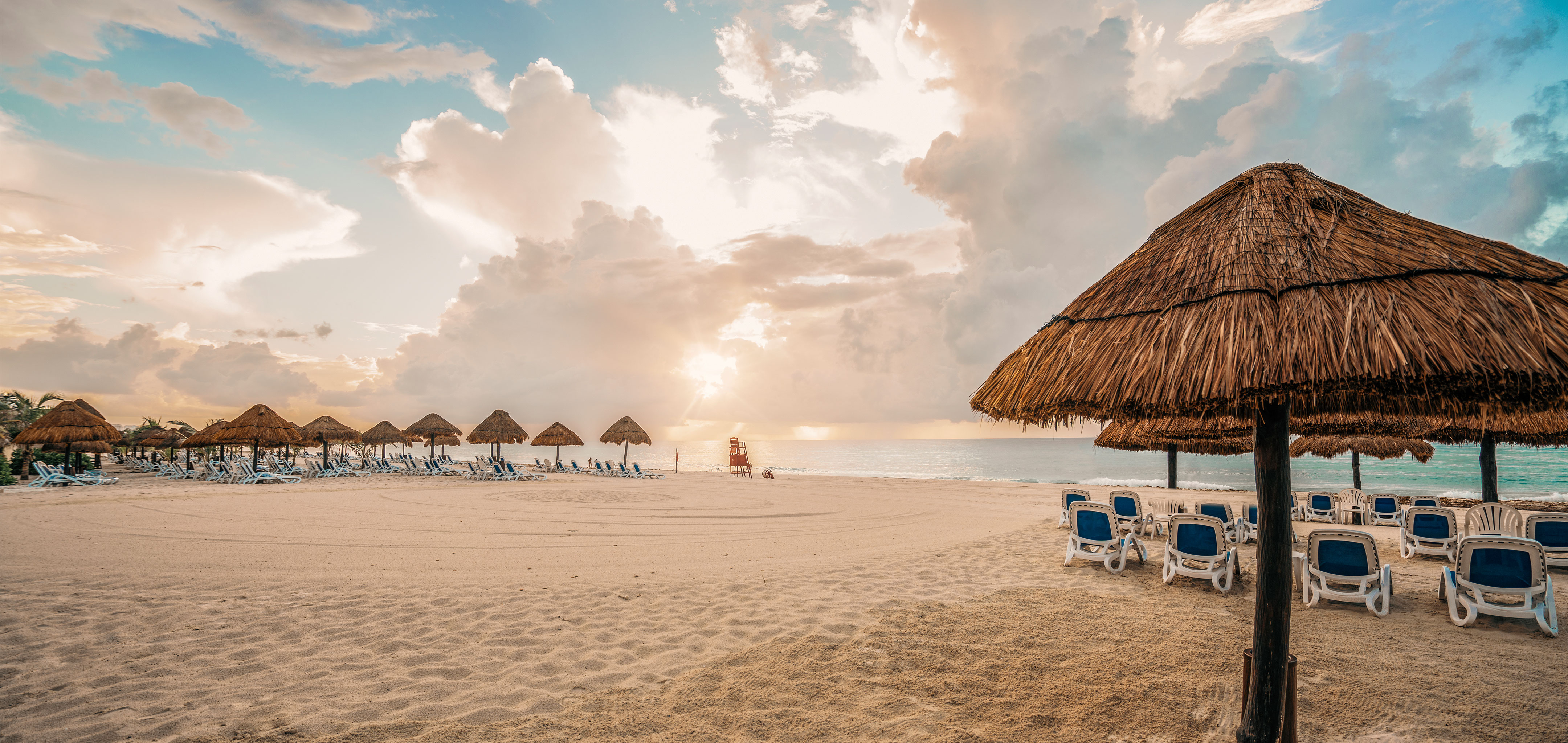 Umbrellas and sun chairs on a beach in Mexico.