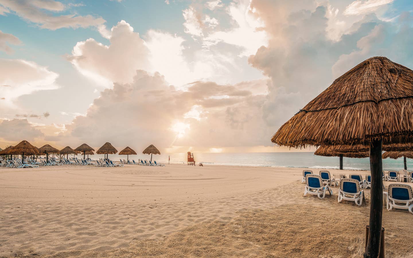 Umbrellas and sun chairs on a beach in Mexico.