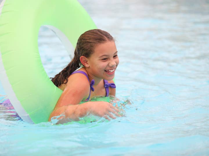 Child floating in tube at Orange Lake Resort near Orlando, Florida.
