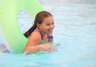 Child floating in tube at Orange Lake Resort near Orlando, Florida.