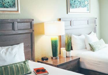 Two beds and a nightstand in a villa in River Island at Orange Lake Resort near Orlando, Florida