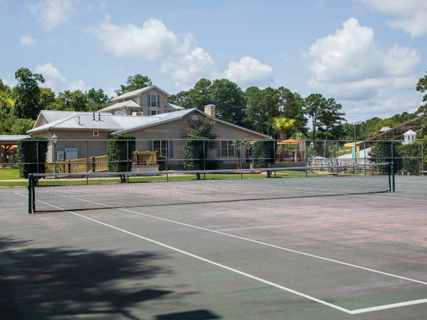 Outdoor tennis court at Villages Resort in Flint, Texas