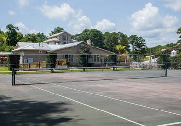 Outdoor tennis court at Villages Resort in Flint, Texas