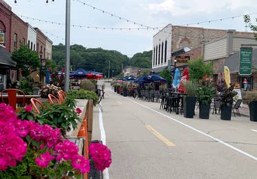 Image of flowers and main street at Utica Town near Fox River Resort in Sheridan, IL.