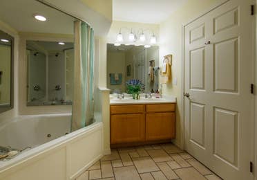 Bathroom with garden tub in a two-bedroom presidential villa at the Holiday Hills Resort in Branson Missouri.