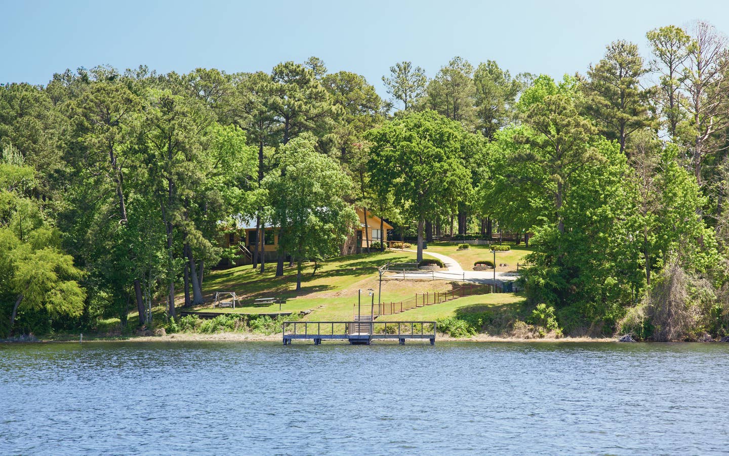 Lake view property with dock and villa at the Lake O' the Wood Resort in Flint Texas.