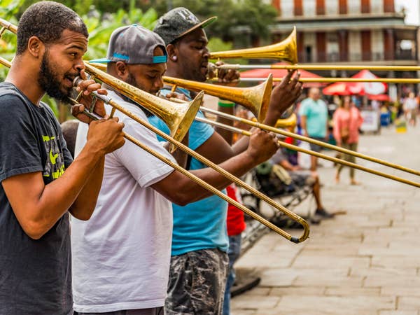 Group of people playing jazz instruments near New Orleans Resort.
