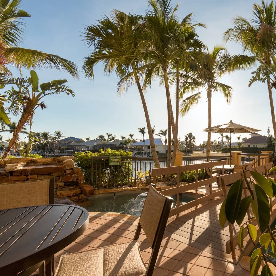 Seating next to the pool at Sunset Cove Resort.