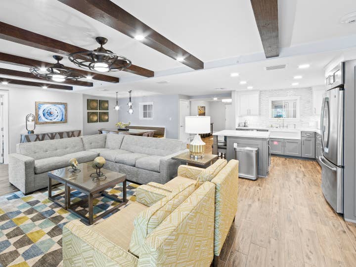Living area and kitchen in a four-bedroom Signature Collection villa at Cape Canaveral Resort