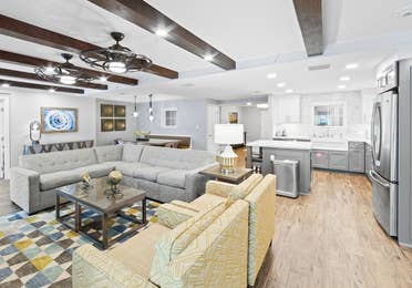 Living area and kitchen in a four-bedroom Signature Collection villa at Cape Canaveral Resort