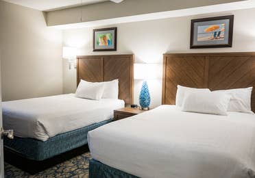 Bedroom with two beds in a villa at Cape Canaveral Beach Resort.
