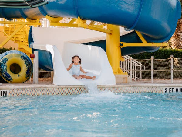 Child going down waterslide at Cape Canaveral Beach Resort in Florida.