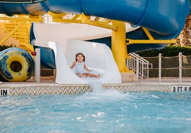 Child going down waterslide at Cape Canaveral Beach Resort in Florida.