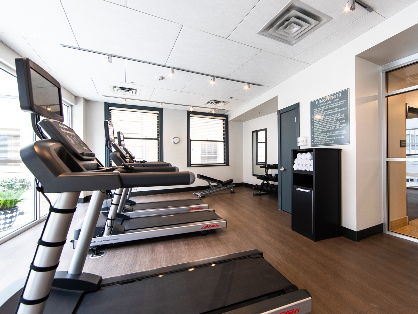 Fitness center with treadmills and free weights at New Orleans Resort in Louisiana.