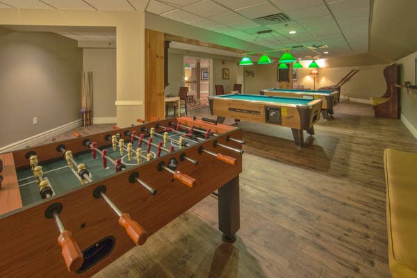 A foosball and two billiard tables in Sidewinders Arcade at Mount Ascutney Resort in Brownsville, VT