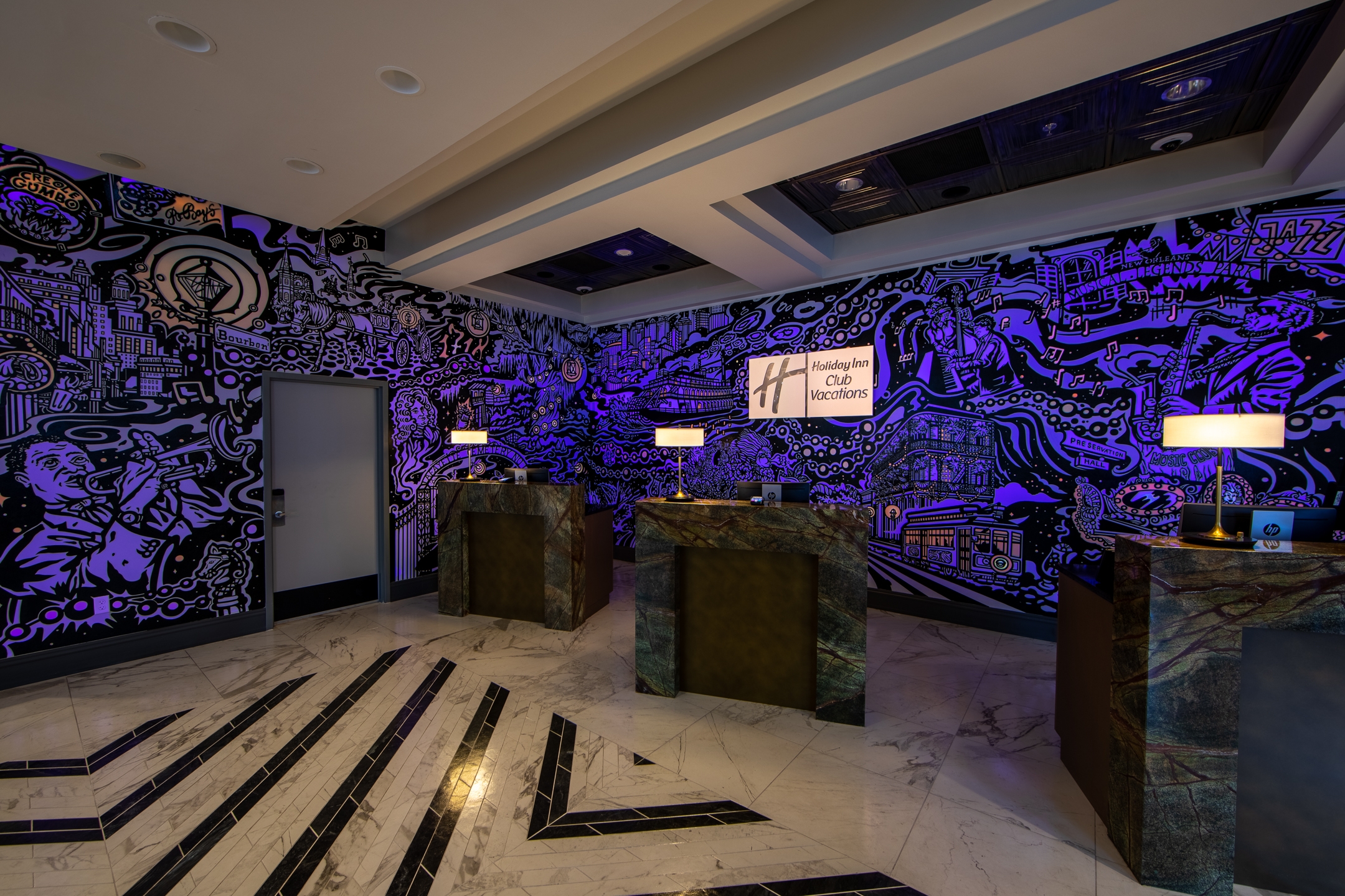 Front desk with mural at New Orleans Resort in Louisiana.