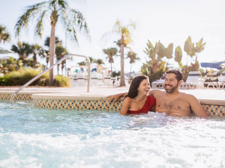 Couple sitting in hot tub at Cape Canaveral Beach Resort in Florida.