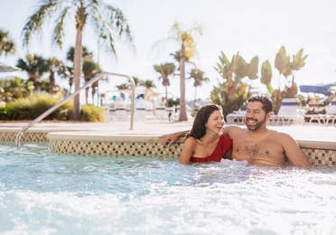 Couple sitting in hot tub at Cape Canaveral Beach Resort in Florida.