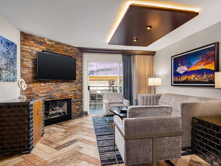 Upscale living room with stone fireplace and contemporary décor.
