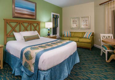 Studio room with a bed, couch and sitting area at South Beach Resort in Myrtle Beach, South Carolina.