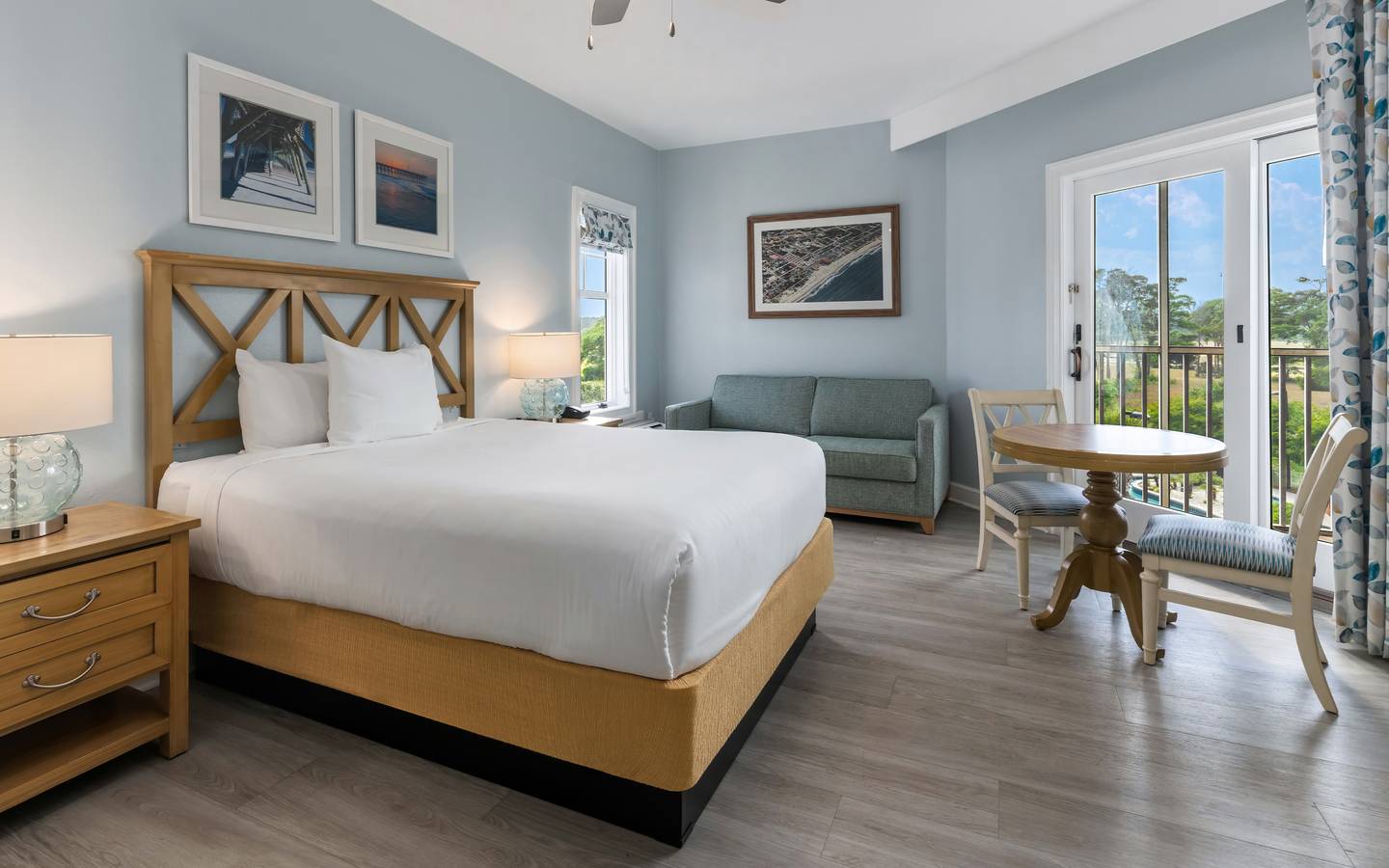 Studio room with a bed, couch and sitting area at South Beach Resort in Myrtle Beach, South Carolina.