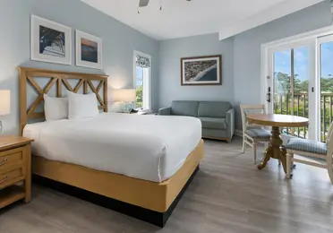 Studio room with a bed, couch and sitting area at South Beach Resort in Myrtle Beach, South Carolina.