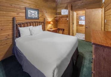 Bedroom in a cabin at Holly Lake Resort in Holly Lake Ranch, Texas.