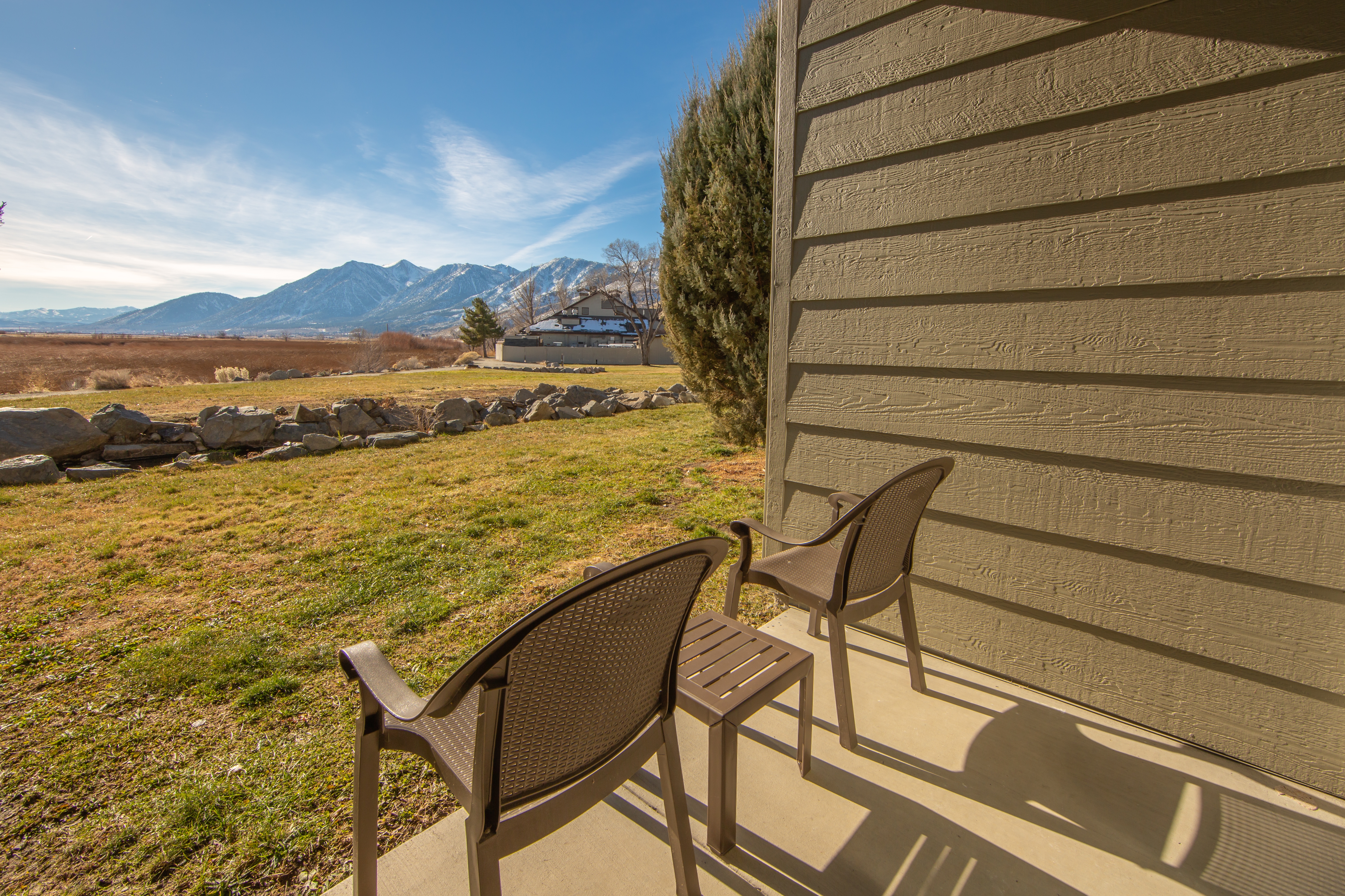 Patio with a view of the Sierra Nevada Mountains outside of a one-bedroom villa at David Walley's Resort in Genoa, Nevada