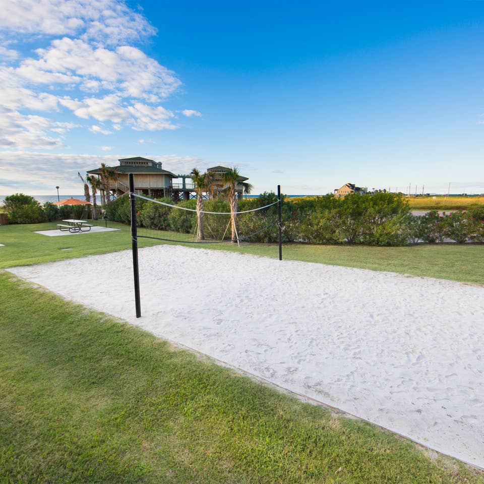 Outdoor sand volleyball court at Galveston Beach Resort in Texas.