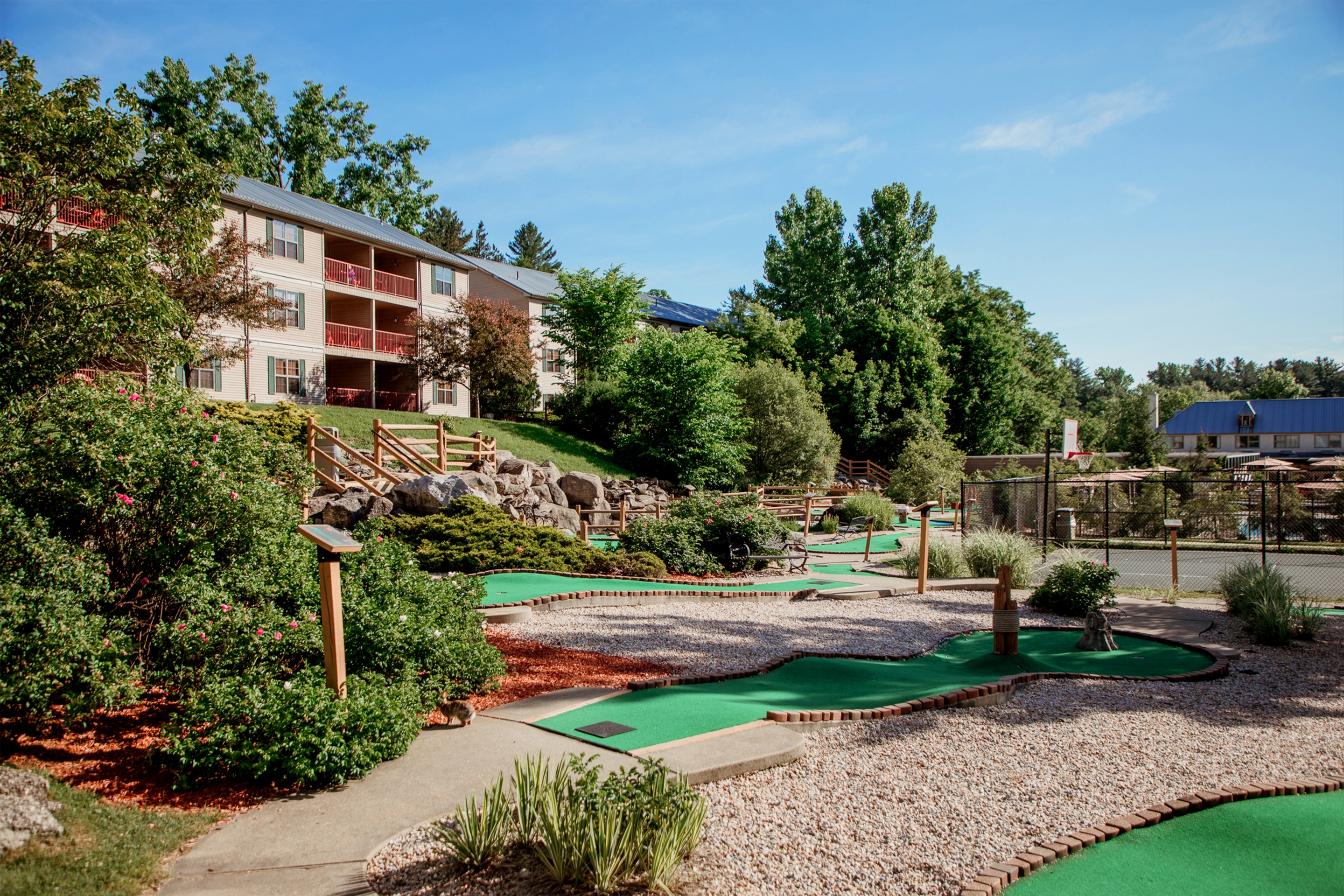 Oak n' Spruce Resort in South Lee, Massachusetts surrounded by well-manicured landscaping.