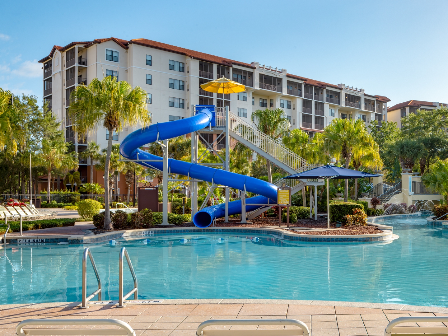 Pool with water slide in River Island at Orange Lake Resort near Orlando, Florida.