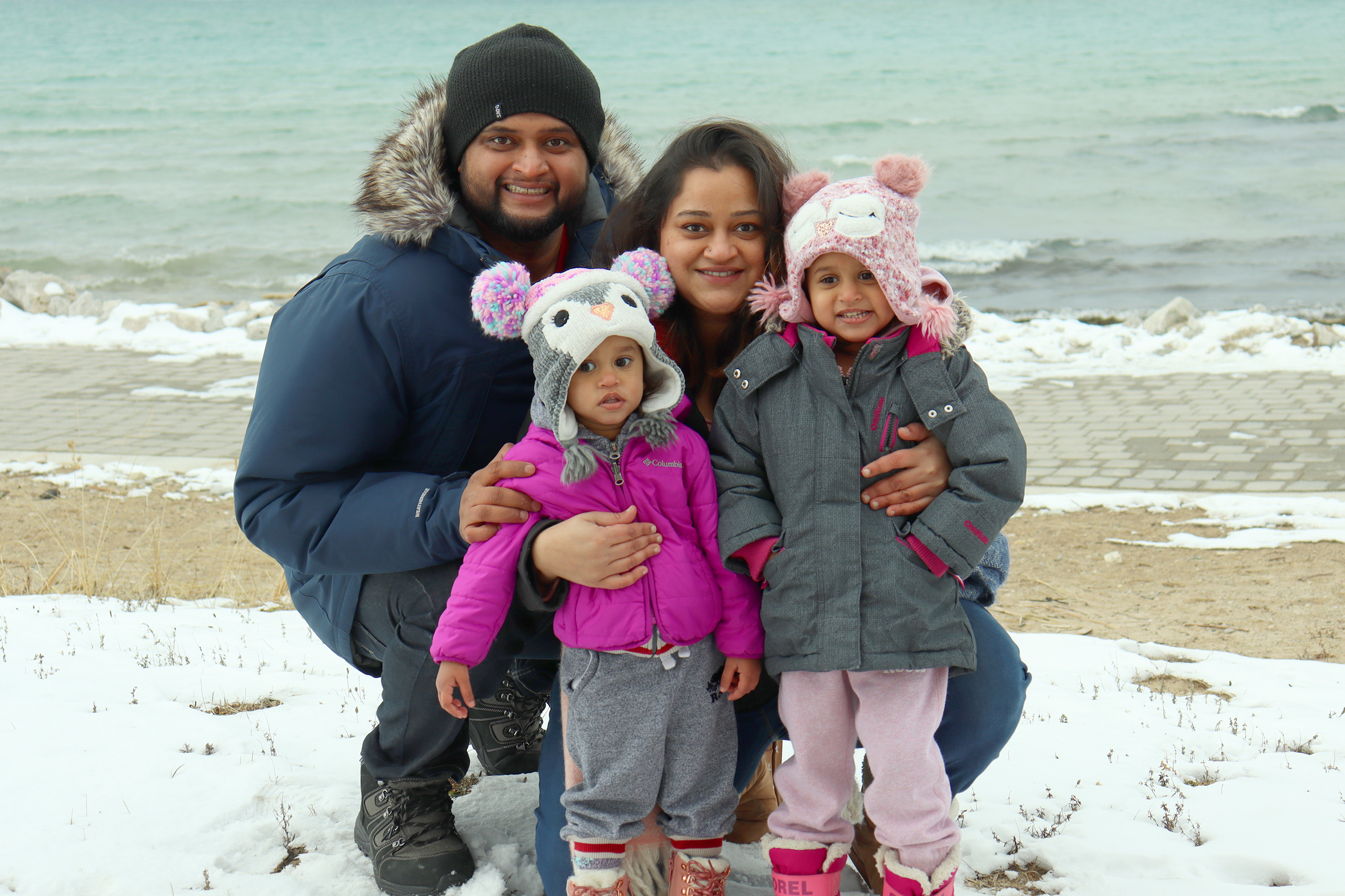Featured Contributor, Karishma Kittur (right), her husband, Rohan (left) and two daughters, Myrra (front-left) and Amarra (front-right).