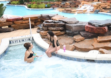 Family relaxing in hot tub at Orange Lake Resort near Orlando, Florida