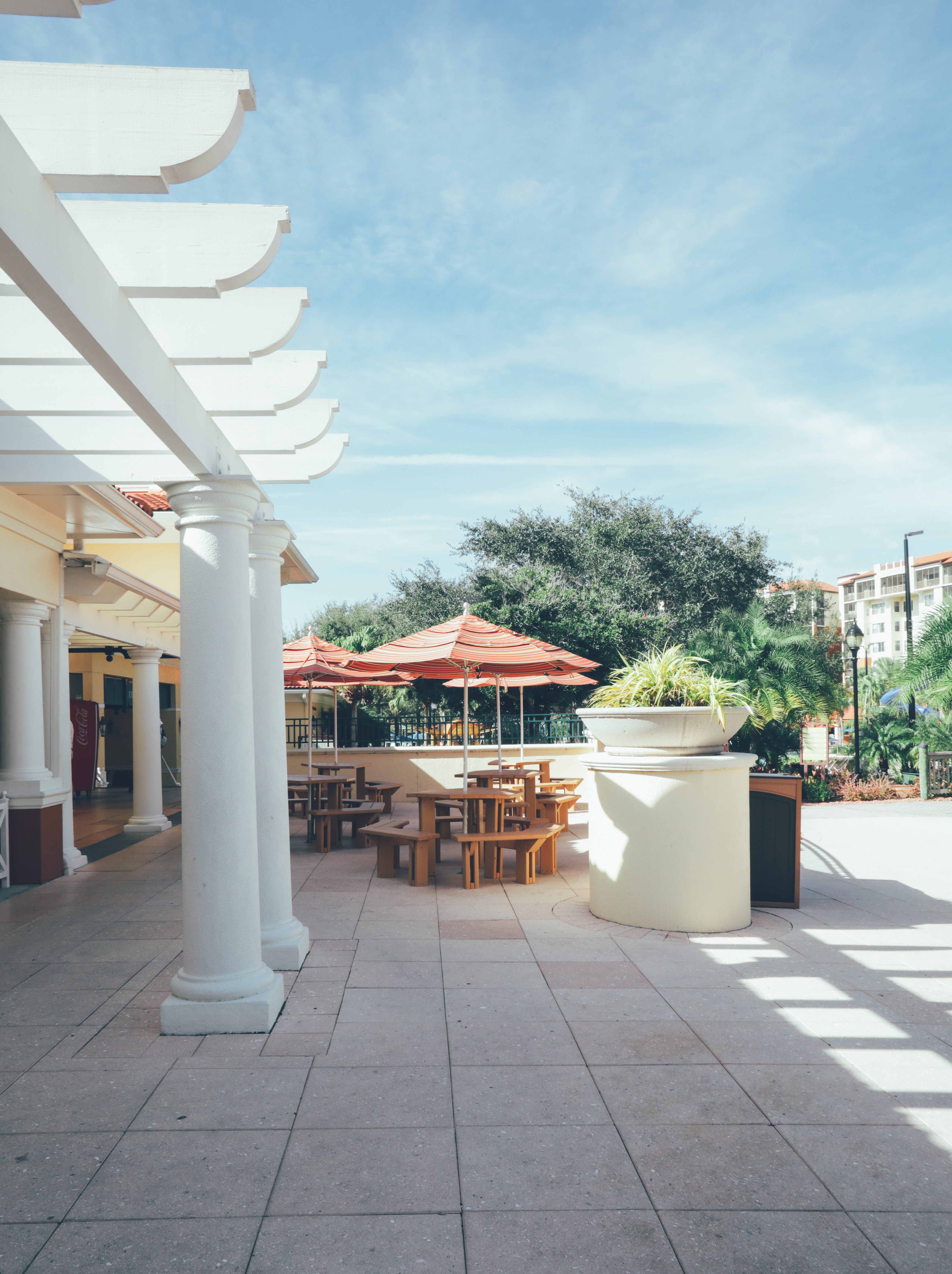 Outdoor seating under umbrellas in River Island at Orange Lake Resort near Orlando, Florida