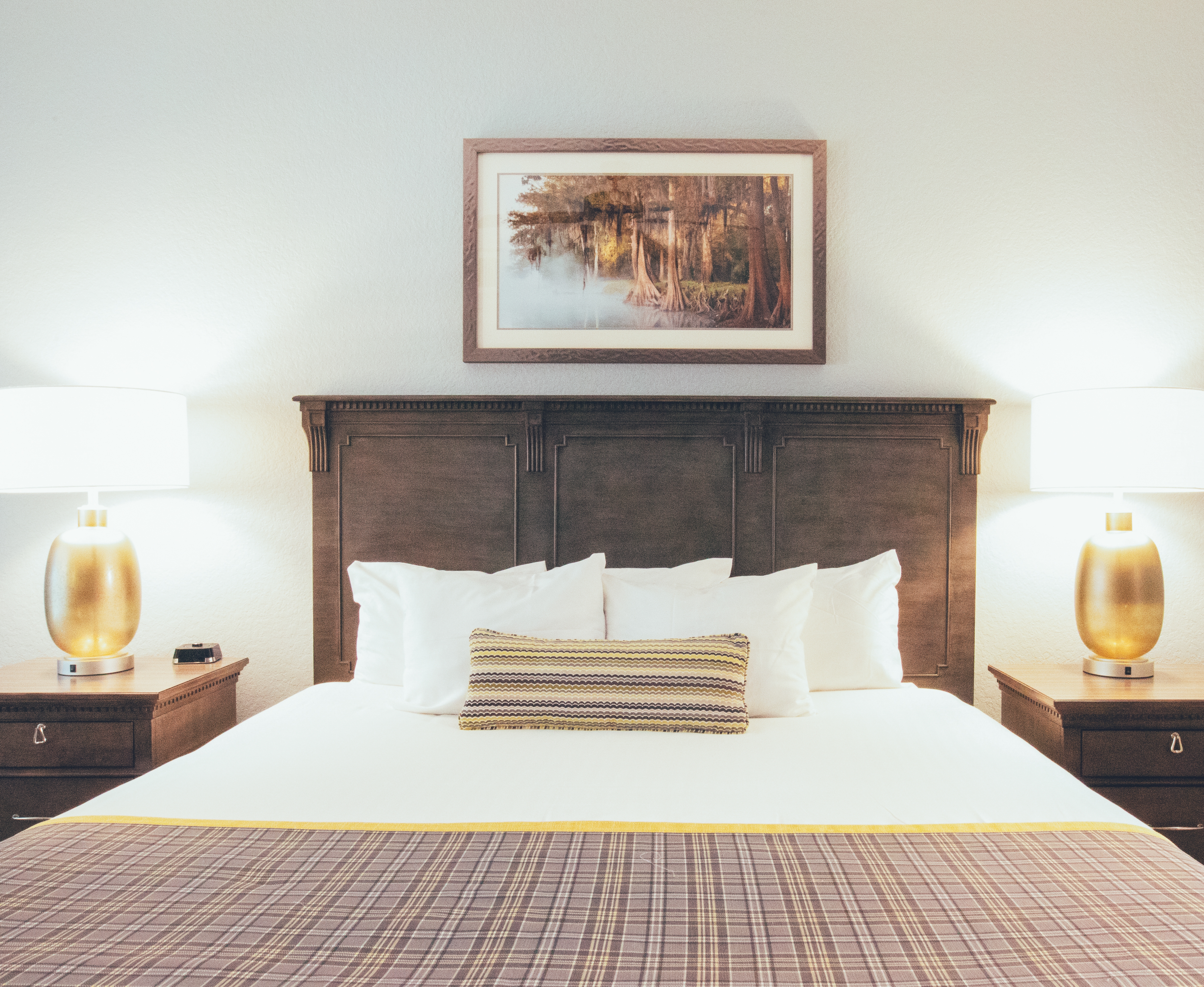 Bed with two nightstands in a villa in River Island at Orange Lake Resort near Orlando, Florida