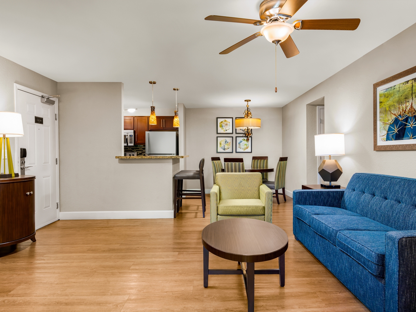 Bright, open living area with stylish furnishings and full kitchen.
