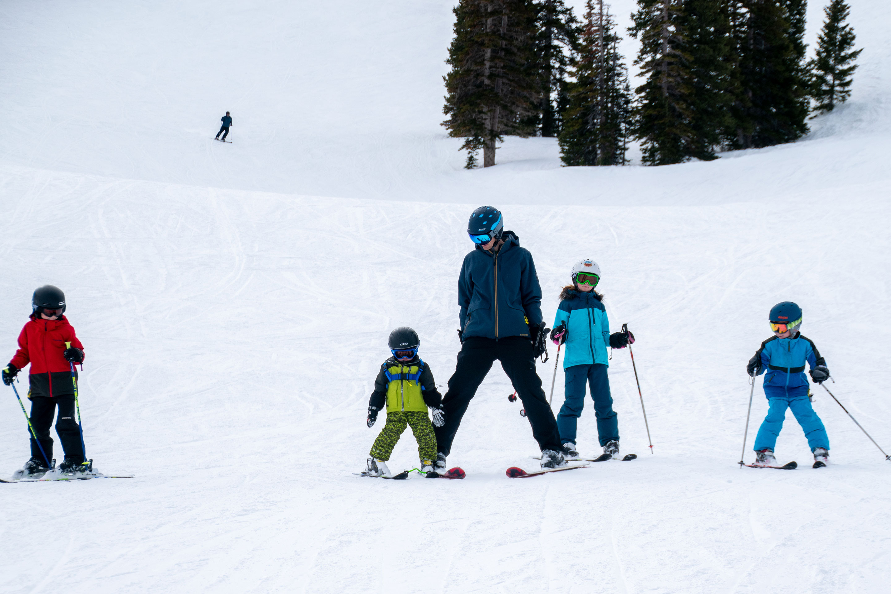 Jessica's family, adorn with ski gear, make their way down the snowy slopes.