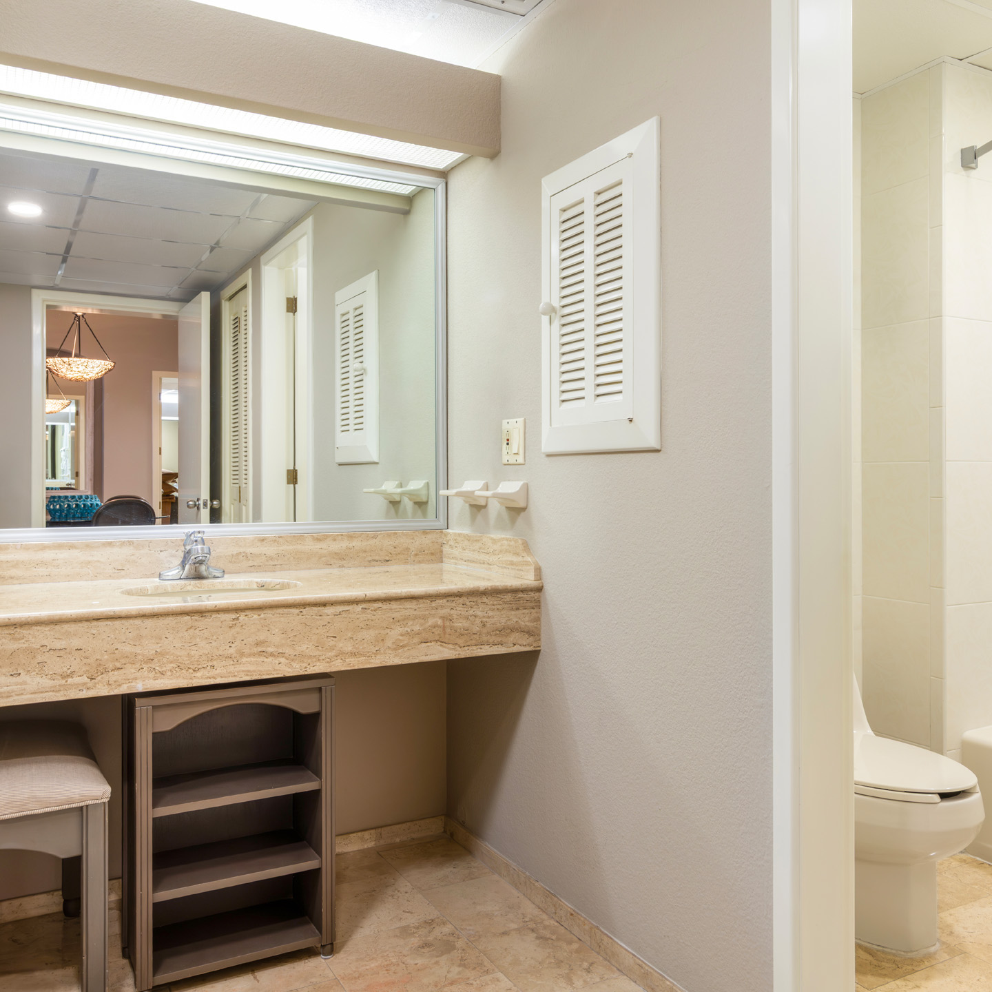 Spacious resort-view balcony with loungers and dining set. 