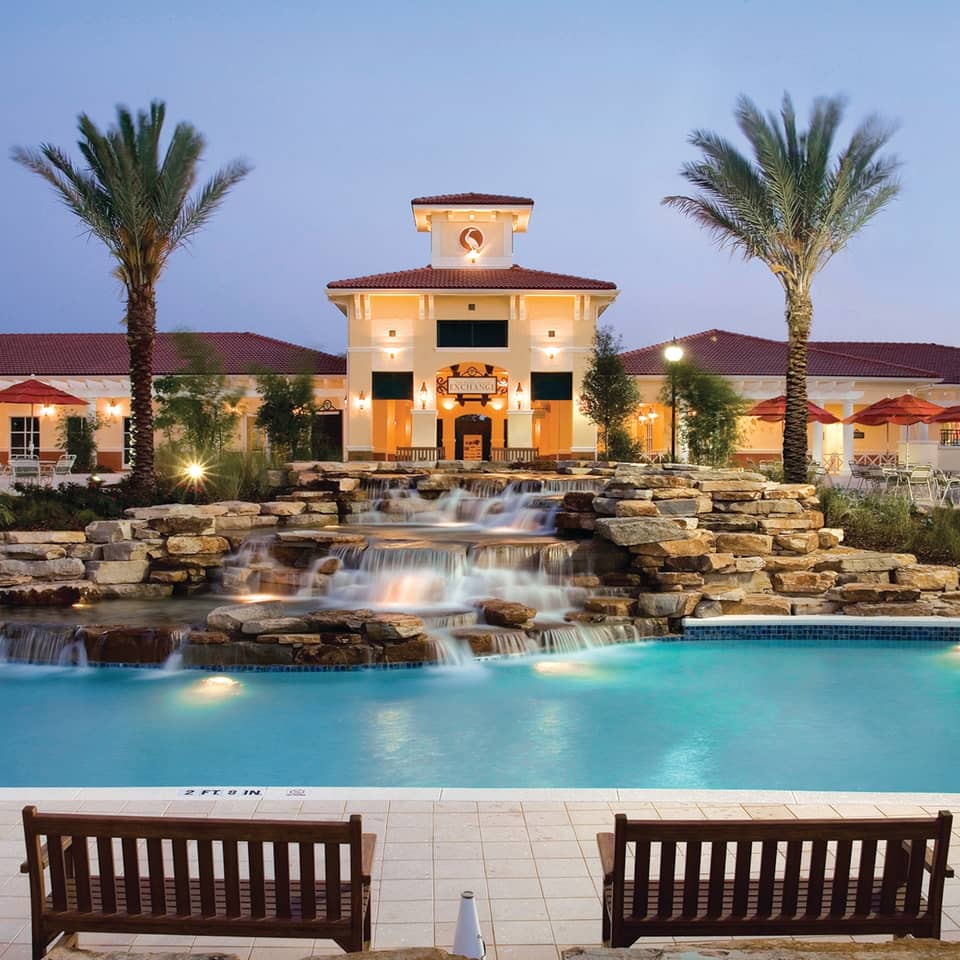 View of lazy river and The Exchange at night in River Island at Orange Lake Resort near Orlando, Florida